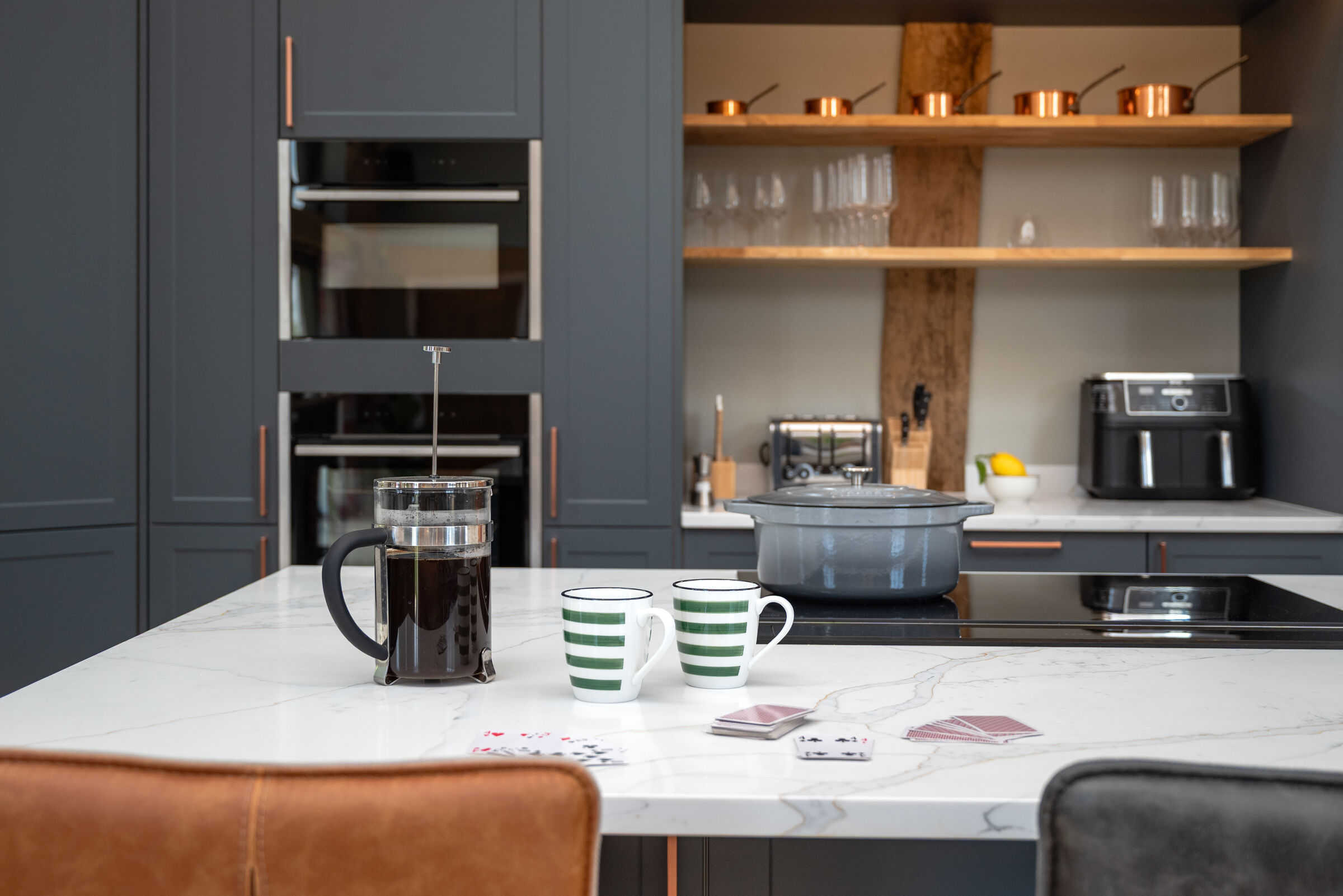 Copper pans on open shelving