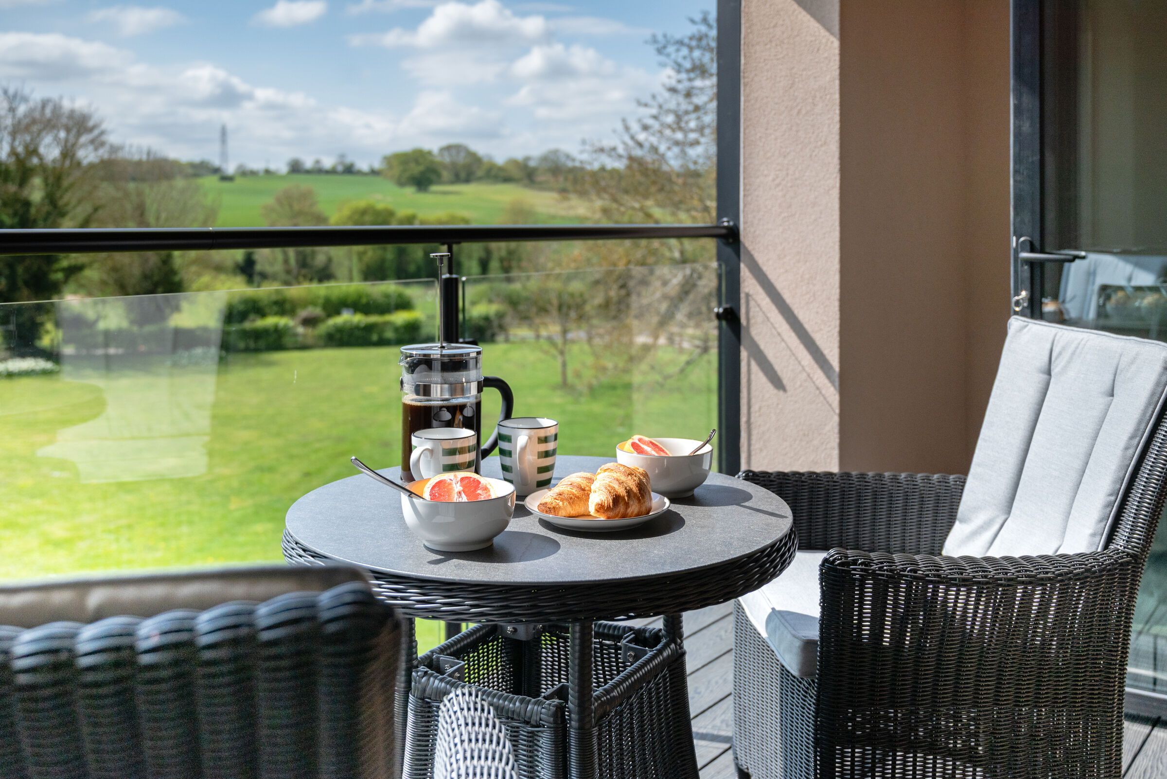 Breakfast on the private upper balcony with field views