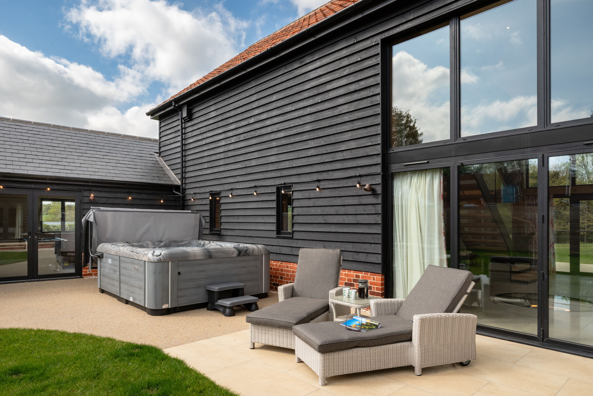 Hot tub patio beside the barn